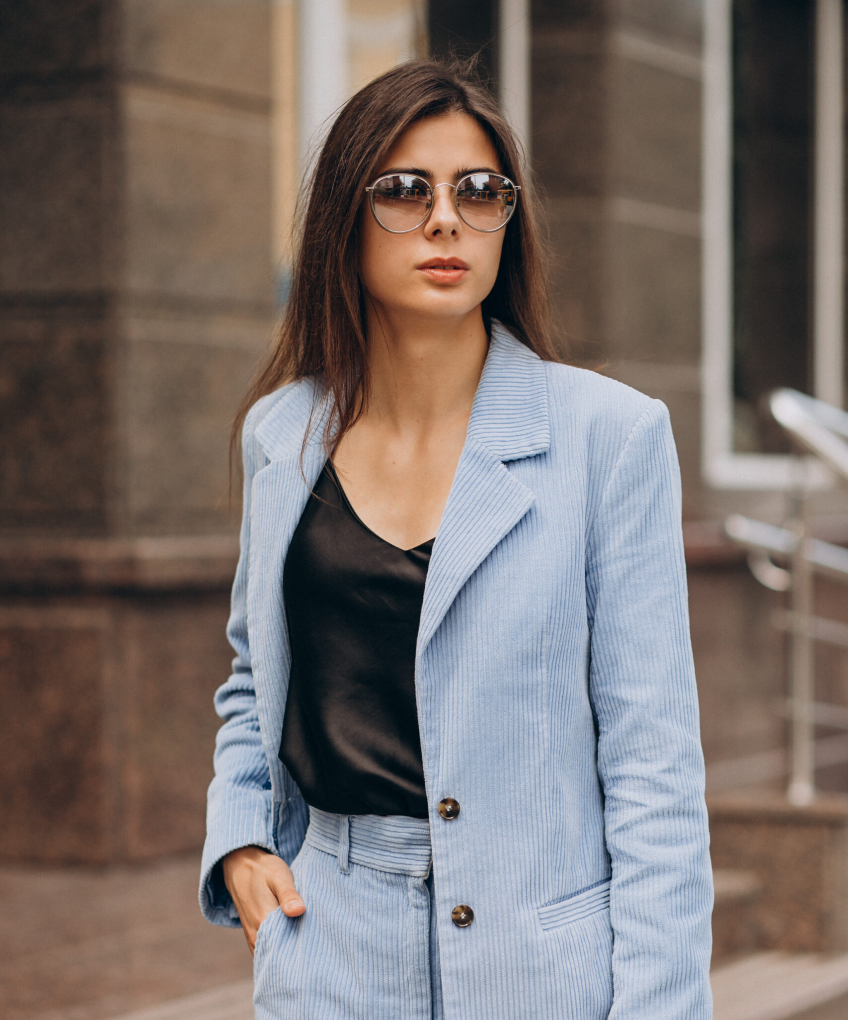 Young business woman dressed in blue suit